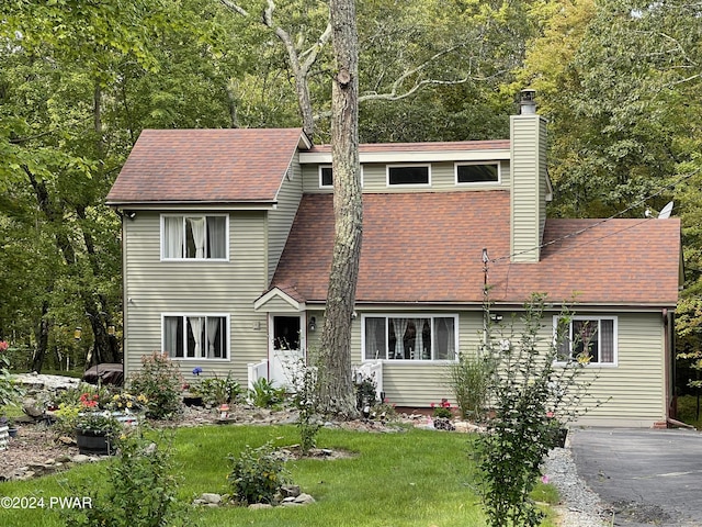 803 Fetlock Ct, Lords Valley, PA 18428 - view of front of house featuring a chimney, a front yard, and a shingled roof
