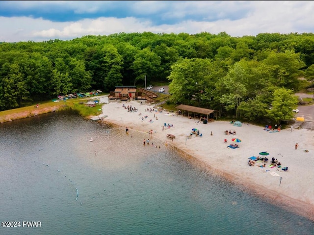 birds eye view of property featuring a water view and a view of the beach