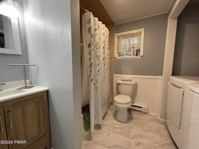 bathroom featuring washer and clothes dryer, vanity, a baseboard radiator, and toilet