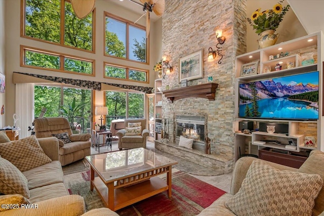 104 Chapel Ct, Greentown, PA 18426 - living area with a high ceiling, a fireplace, and plenty of natural light