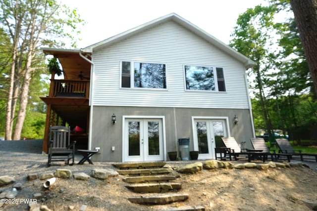 132 N Lake Shore Dr, Dingmans Ferry, PA 18328 - rear view of property featuring french doors, a ceiling fan, stucco siding, and a balcony