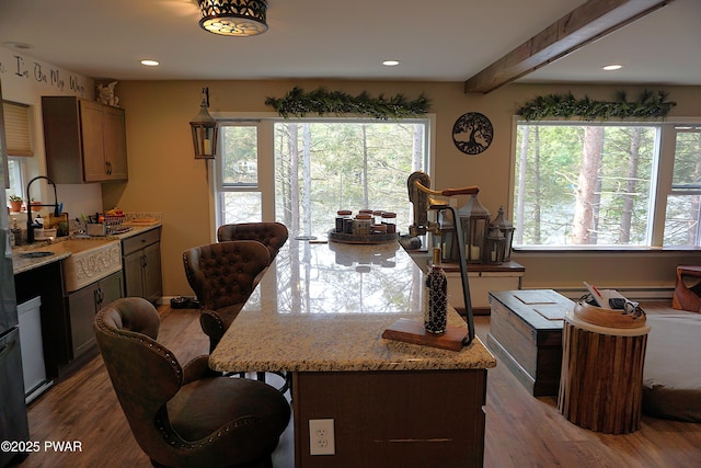 132 N Lake Shore Dr, Dingmans Ferry, PA 18328 - kitchen featuring dark wood-style floors, a kitchen breakfast bar, recessed lighting, light stone counters, and beam ceiling