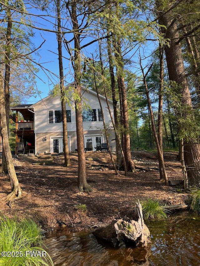 132 N Lake Shore Dr, Dingmans Ferry, PA 18328 - rear view of property featuring a balcony