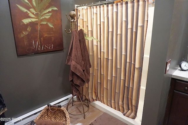 132 N Lake Shore Dr, Dingmans Ferry, PA 18328 - full bathroom featuring baseboard heating, shower / bath combination with curtain, and wood finished floors