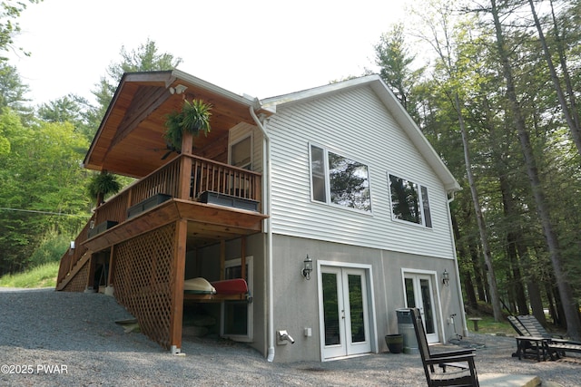132 N Lake Shore Dr, Dingmans Ferry, PA 18328 - back of house featuring french doors, stucco siding, and a deck