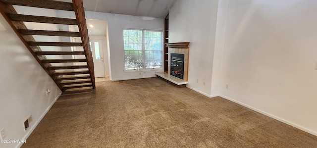 unfurnished living room with carpet