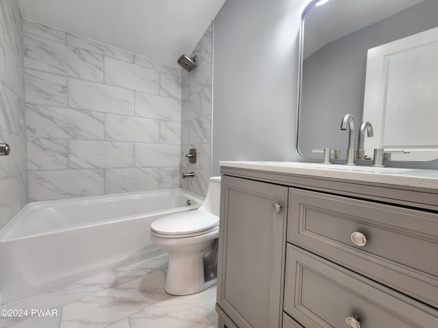 full bathroom with vanity, tiled shower / bath combo, and toilet