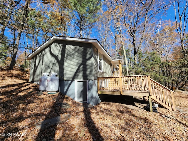 view of home's exterior featuring a wooden deck