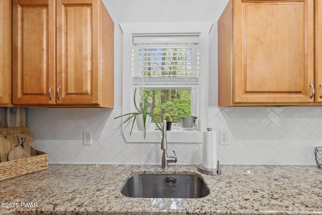 9326 Fairmount Way, Tobyhanna, PA 18466 - kitchen with a sink, tasteful backsplash, and light stone countertops