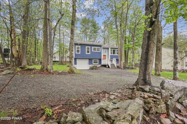 9326 Fairmount Way, Tobyhanna, PA 18466 - bi-level home featuring gravel driveway and a garage