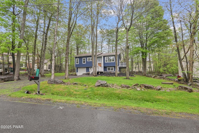 9326 Fairmount Way, Tobyhanna, PA 18466 - bi-level home featuring a garage, a front lawn, and driveway