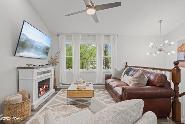 9326 Fairmount Way, Tobyhanna, PA 18466 - living area with lofted ceiling, ceiling fan, a baseboard heating unit, baseboard heating, and a chandelier