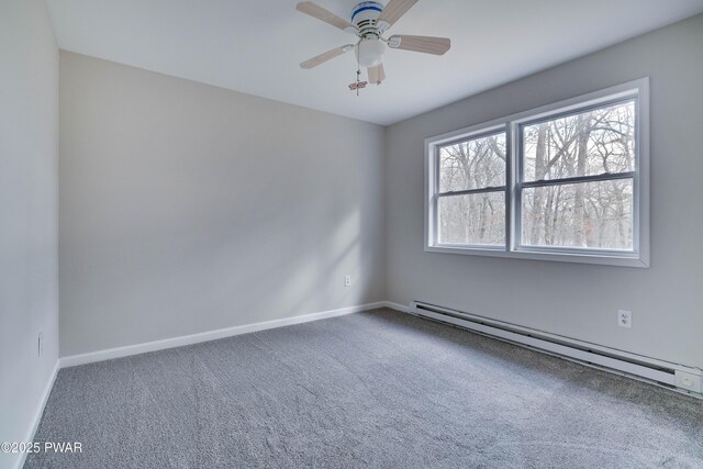 empty room with carpet flooring, ceiling fan, and a baseboard radiator