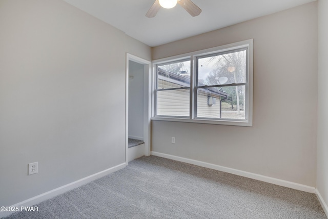 carpeted empty room with ceiling fan