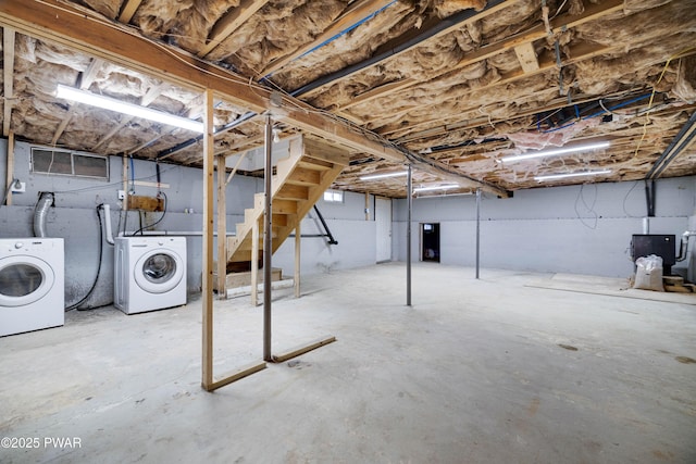 basement with washing machine and clothes dryer