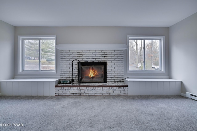 unfurnished living room featuring a fireplace and carpet floors