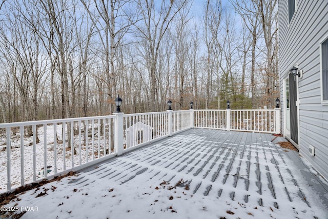 view of snow covered deck