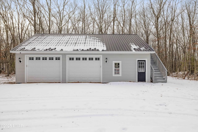 view of snow covered garage