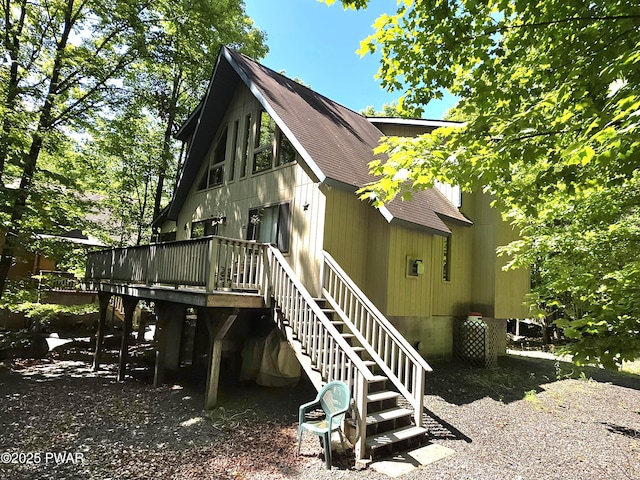 22 Thornwood Ter, Lake Ariel, PA 18436 - rear view of property with roof with shingles, stairway, and a wooden deck