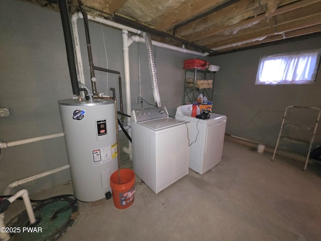laundry area with independent washer and dryer, laundry area, and electric water heater