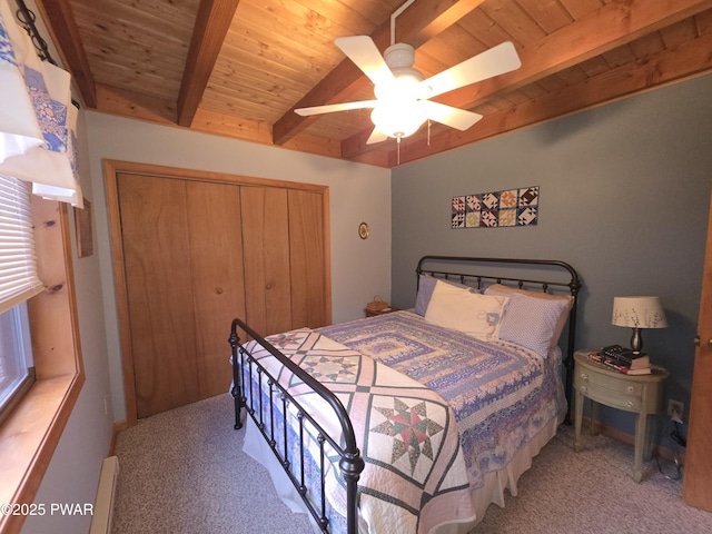 bedroom featuring wooden ceiling, a closet, carpet flooring, a ceiling fan, and vaulted ceiling with beams
