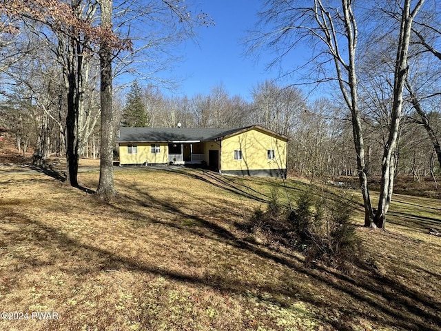 view of home's exterior with a lawn