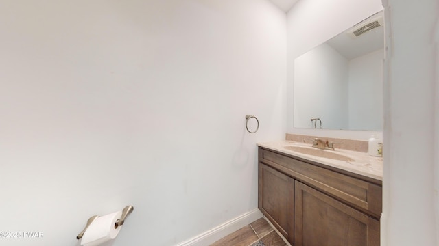 bathroom featuring vanity and wood-type flooring