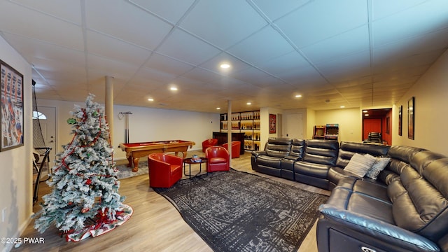 living room featuring a drop ceiling, pool table, and light wood-type flooring