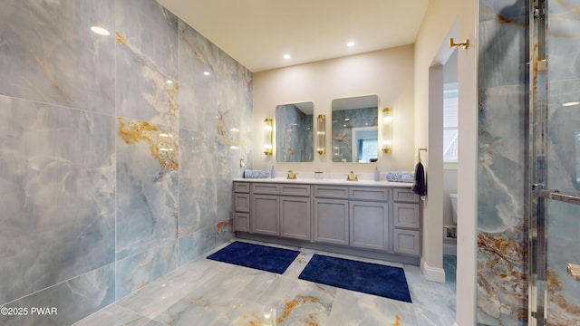 bathroom with vanity, toilet, and a shower with shower door