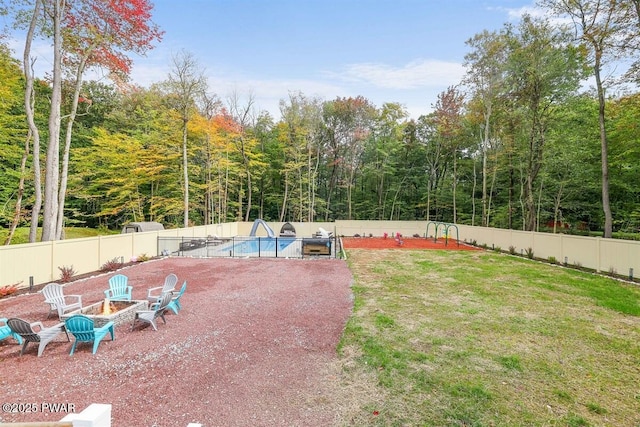 view of yard with a fenced in pool