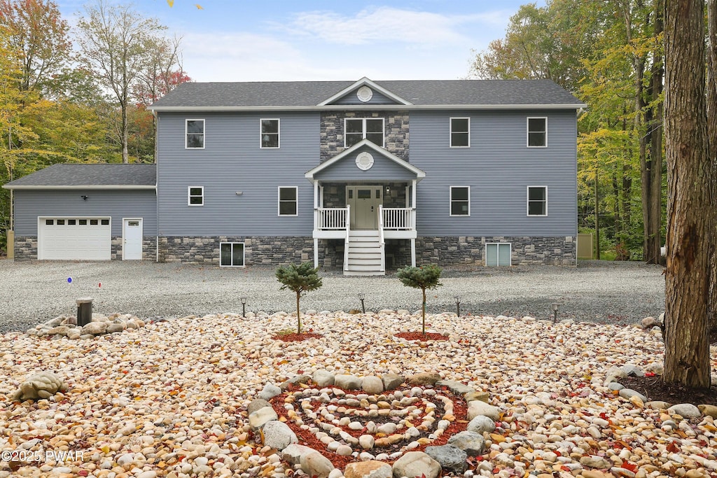 view of front of house with a garage and covered porch