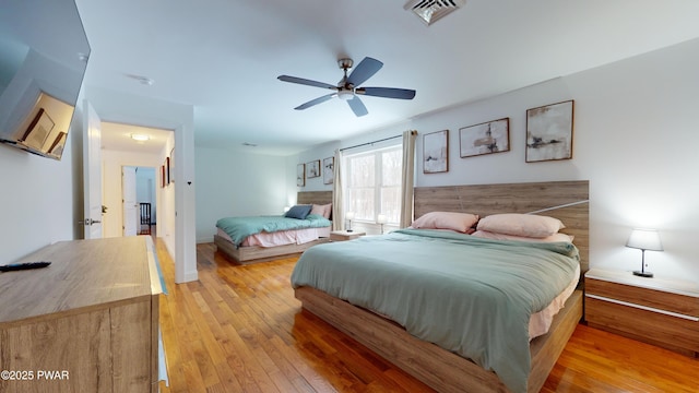 bedroom featuring ceiling fan and light wood-type flooring