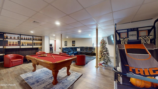 game room featuring a drop ceiling, wood-type flooring, billiards, and indoor bar