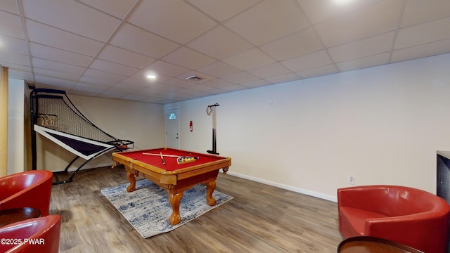 playroom with a paneled ceiling, pool table, and hardwood / wood-style floors