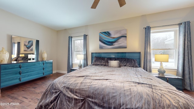 bedroom featuring dark hardwood / wood-style flooring and ceiling fan