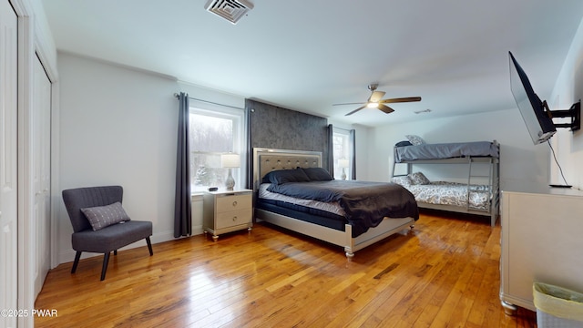 bedroom featuring light hardwood / wood-style flooring and ceiling fan