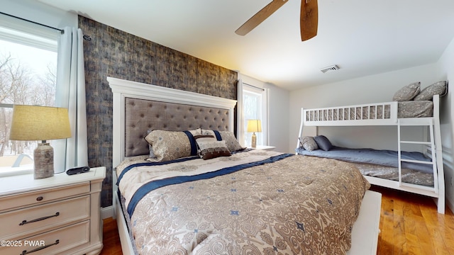 bedroom featuring wood-type flooring and ceiling fan