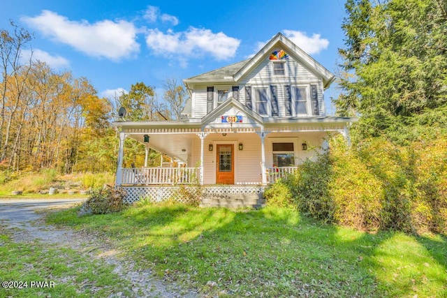 517 Sherman Rd, Susquehanna, PA 18847 - victorian house featuring covered porch and a front lawn