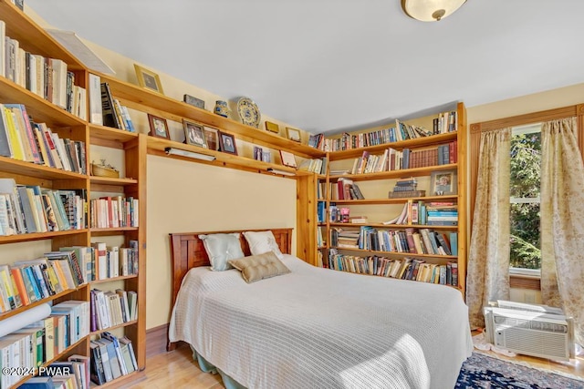 517 Sherman Rd, Susquehanna, PA 18847 - bedroom featuring wood finished floors and a wall mounted air conditioner