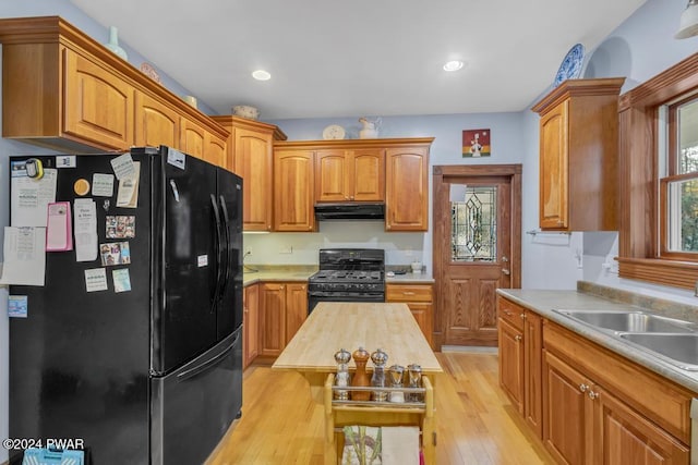 517 Sherman Rd, Susquehanna, PA 18847 - kitchen with black appliances, extractor fan, light wood-style flooring, brown cabinets, and recessed lighting