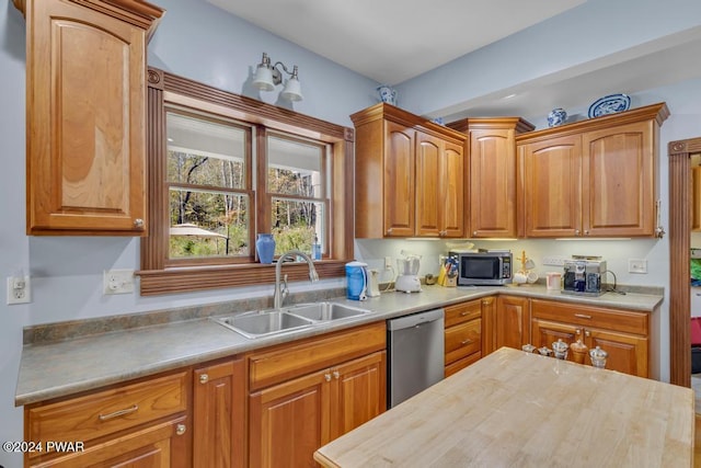 517 Sherman Rd, Susquehanna, PA 18847 - kitchen featuring appliances with stainless steel finishes, a sink, brown cabinetry, and wooden counters