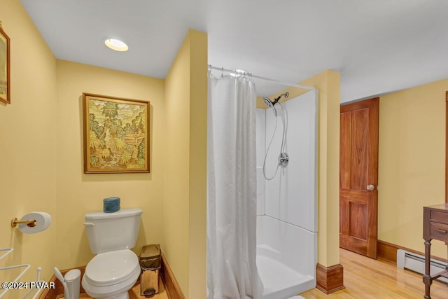 517 Sherman Rd, Susquehanna, PA 18847 - full bath featuring curtained shower, wood finished floors, a baseboard radiator, toilet, and baseboards