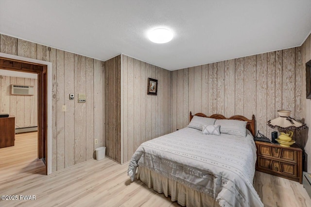 518 Lakeview Dr E, Lake Ariel, PA 18436 - bedroom with a baseboard heating unit, wood finished floors, a wall mounted AC, and wood walls