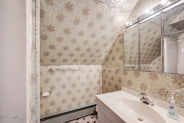 518 Lakeview Dr E, Lake Ariel, PA 18436 - bathroom featuring baseboard heating, vaulted ceiling, and vanity