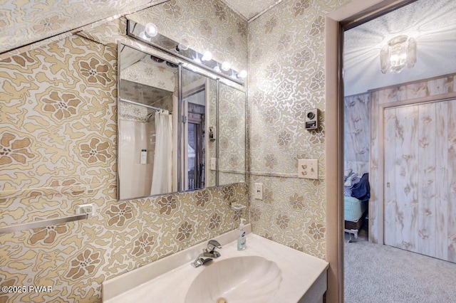 518 Lakeview Dr E, Lake Ariel, PA 18436 - bathroom featuring wallpapered walls, vanity, and a shower with curtain