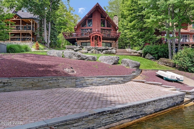 518 Lakeview Dr E, Lake Ariel, PA 18436 - view of front of home with a chimney and a deck with water view