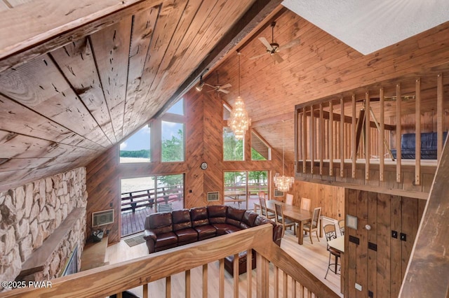 518 Lakeview Dr E, Lake Ariel, PA 18436 - living area featuring wooden walls, wooden ceiling, vaulted ceiling, a chandelier, and ceiling fan