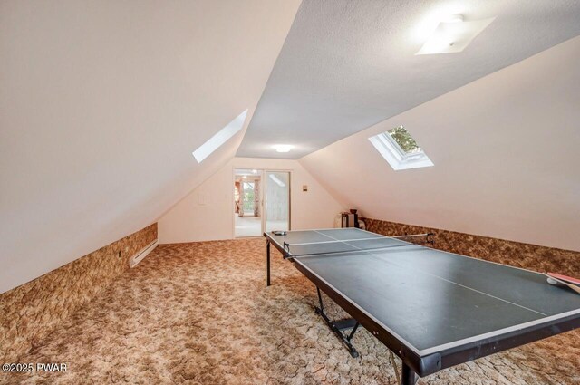 518 Lakeview Dr E, Lake Ariel, PA 18436 - recreation room featuring a skylight, lofted ceiling, and carpet floors