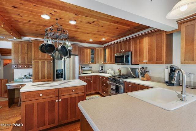 58 Rude Rd, Waymart, PA 18472 - kitchen with stainless steel appliances, wood ceiling, brown cabinetry, light countertops, and recessed lighting