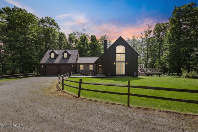 58 Rude Rd, Waymart, PA 18472 - view of front of home featuring dirt driveway, a chimney, stone siding, and an attached garage